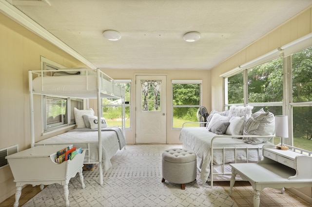 bedroom with multiple windows