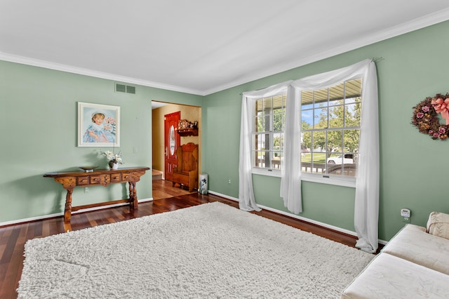 interior space featuring ornamental molding and dark wood-type flooring