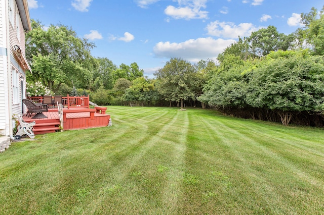 view of yard with a deck