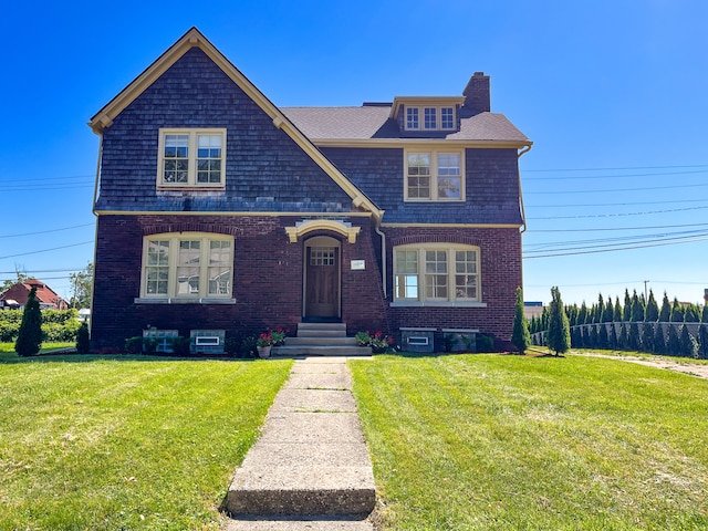 488 Parkview Dr, Detroit, MI 48214 - view of front of home featuring a chimney, a front lawn, and brick siding