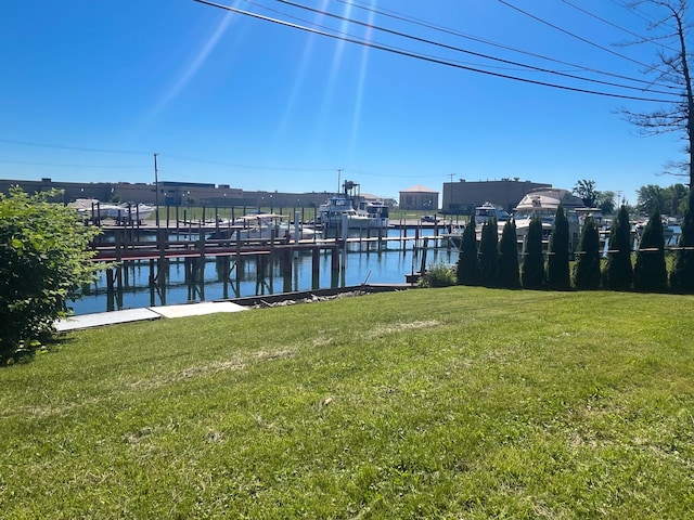 488 Parkview Dr, Detroit, MI 48214 - dock area with a water view and a lawn