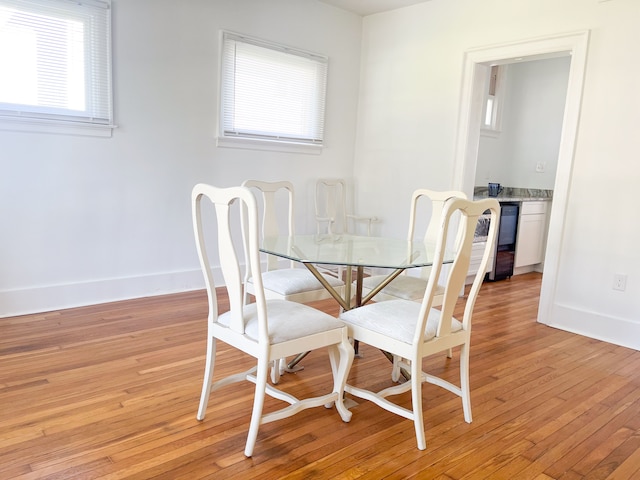 dining space featuring light wood-type flooring