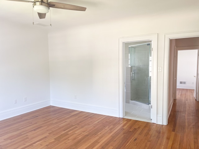 unfurnished room featuring hardwood / wood-style flooring and ceiling fan