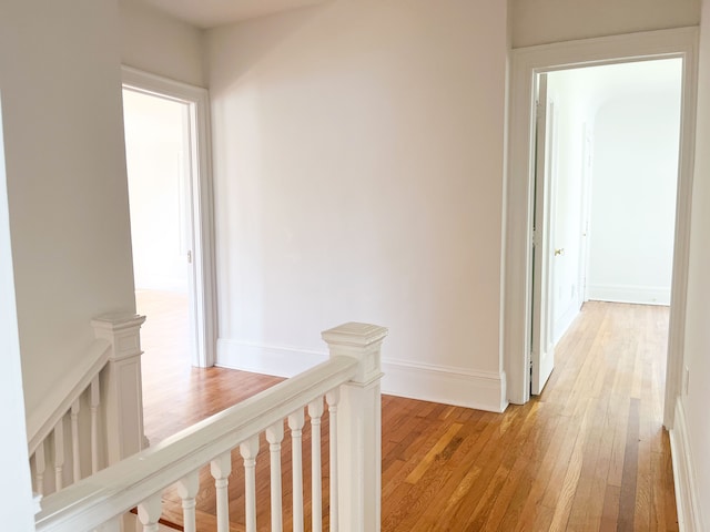 488 Parkview Dr, Detroit, MI 48214 - hallway with an upstairs landing, light wood-style floors, and baseboards