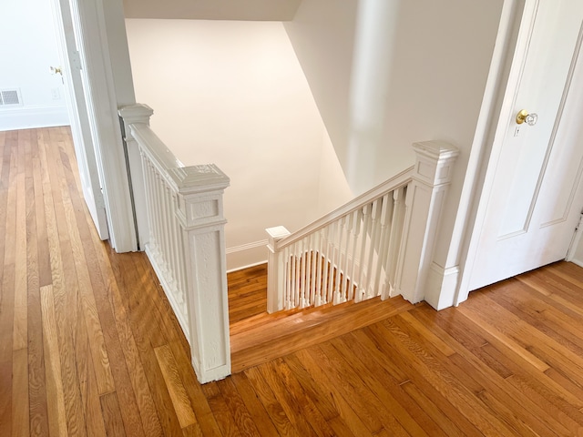 stairway featuring wood-type flooring