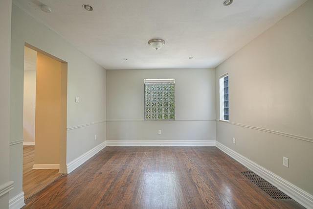 empty room featuring dark hardwood / wood-style floors