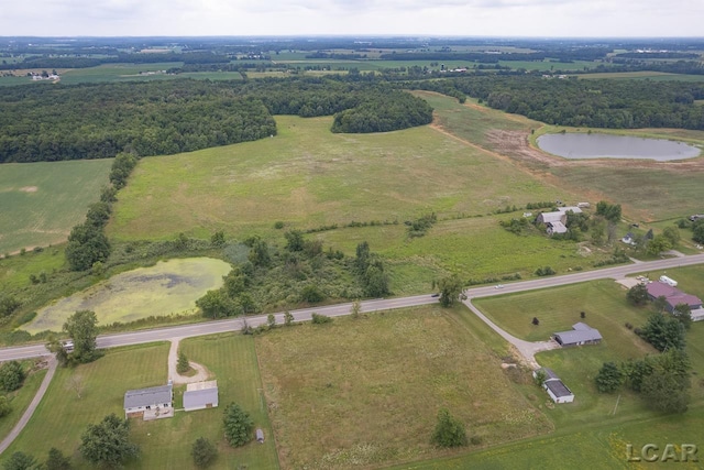 aerial view featuring a rural view and a water view