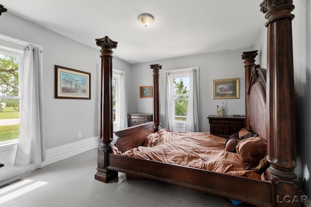 bedroom with multiple windows