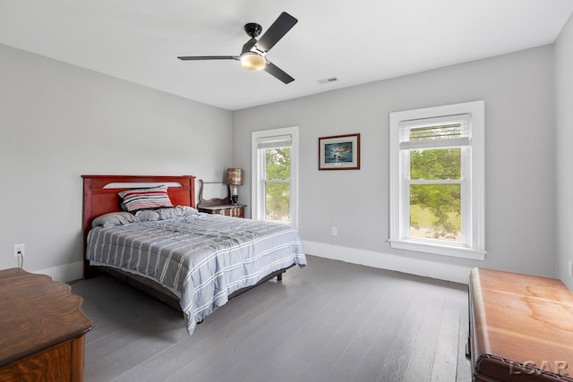 bedroom featuring ceiling fan and dark hardwood / wood-style flooring