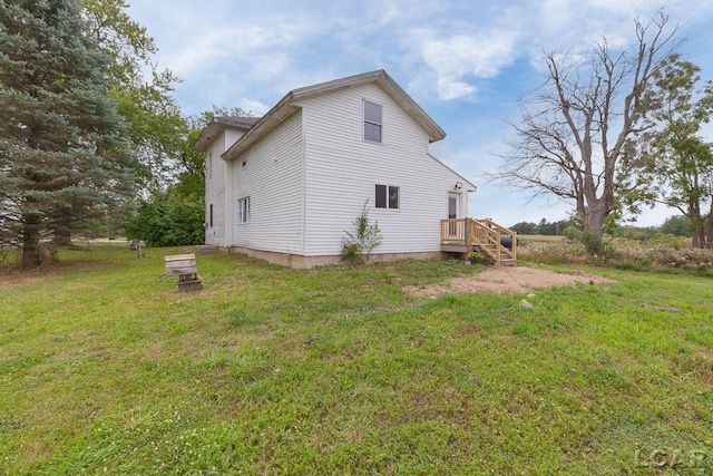 view of side of home featuring a yard