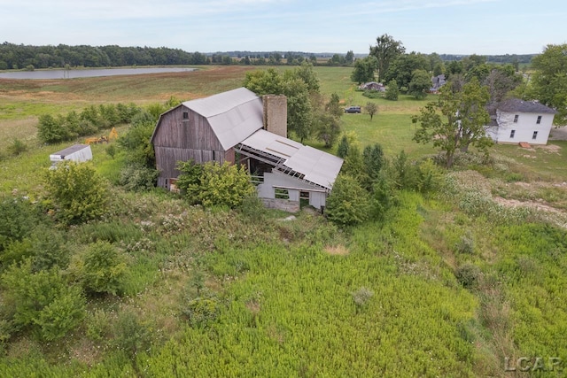 birds eye view of property featuring a rural view