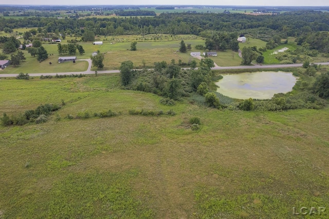 drone / aerial view with a rural view and a water view