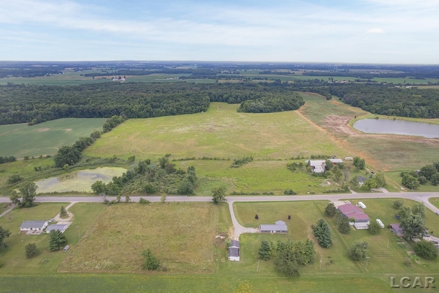 aerial view with a water view and a rural view