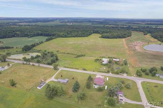 birds eye view of property featuring a water view and a rural view