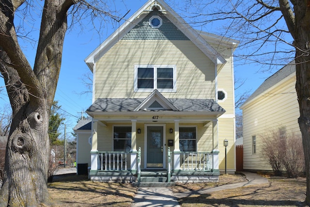 417 Barlow St, Traverse City, MI 49686 - view of front of home with covered porch and roof with shingles