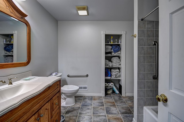417 Barlow St, Traverse City, MI 49686 - full bathroom with vanity, toilet,  shower combination, and baseboards