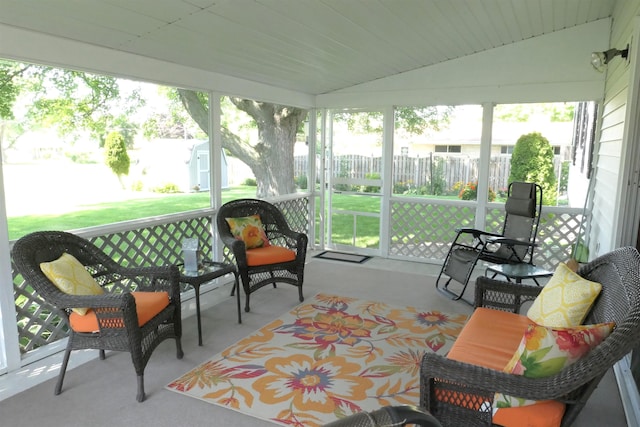 sunroom / solarium featuring vaulted ceiling