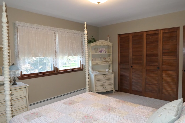 bedroom featuring light carpet, a closet, and a baseboard radiator