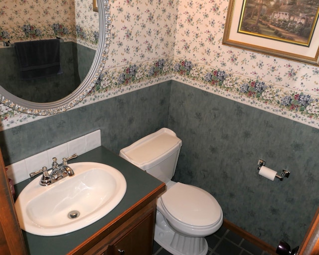 bathroom featuring vanity and toilet