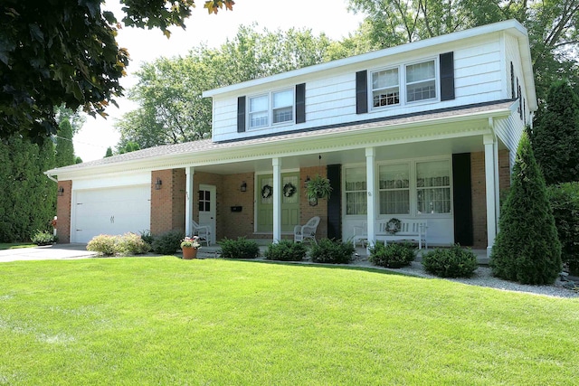 view of front facade with a front yard and a garage