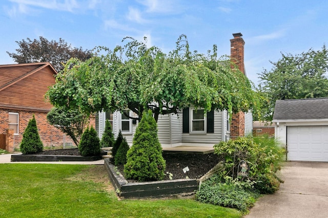 obstructed view of property with a garage and a front lawn