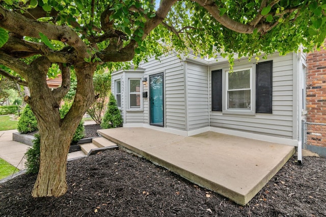 entrance to property with a patio area