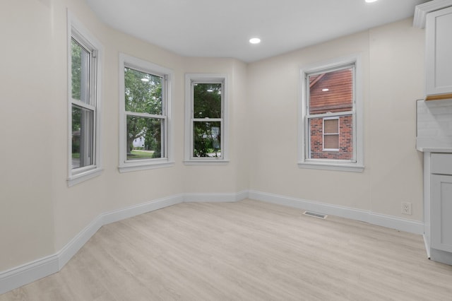 unfurnished dining area with light hardwood / wood-style flooring