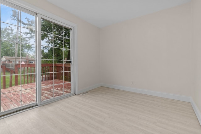 unfurnished room featuring light wood-type flooring