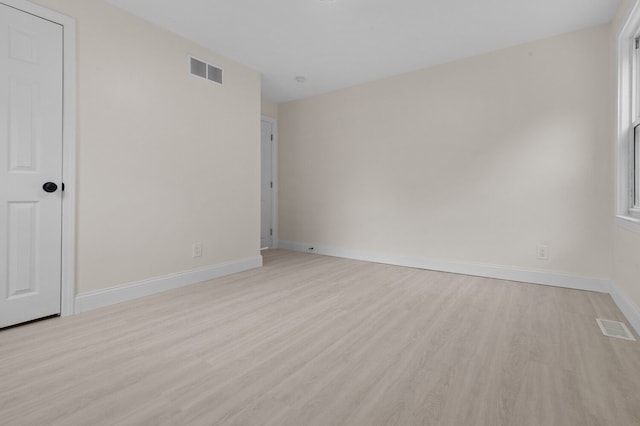 spare room with light wood-type flooring