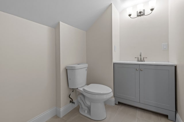 bathroom featuring tile patterned flooring, vanity, and toilet