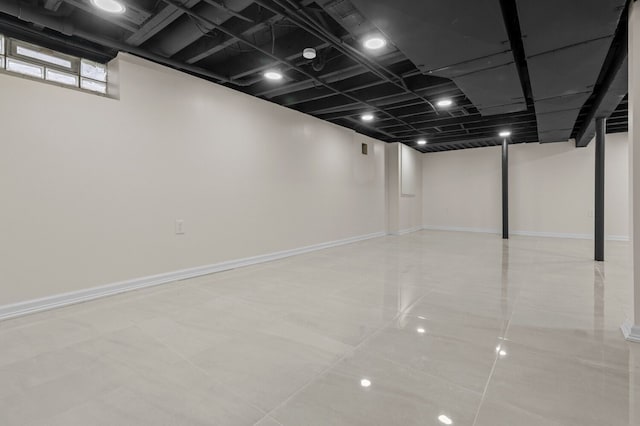 basement featuring light tile patterned floors