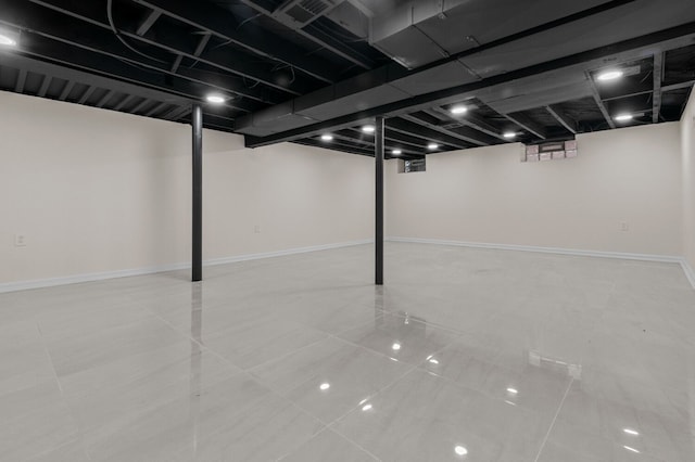 basement with light tile patterned flooring