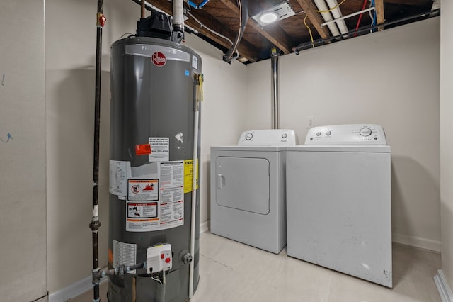 clothes washing area featuring washer and dryer and gas water heater