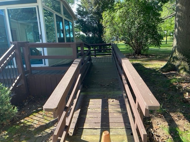 wooden deck with a sunroom