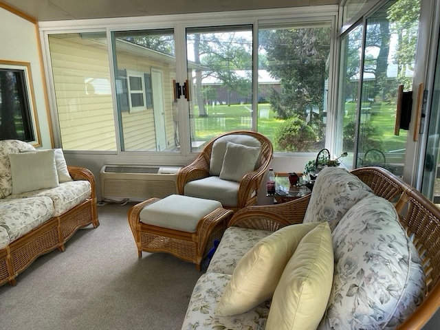 sunroom / solarium featuring a wall unit AC