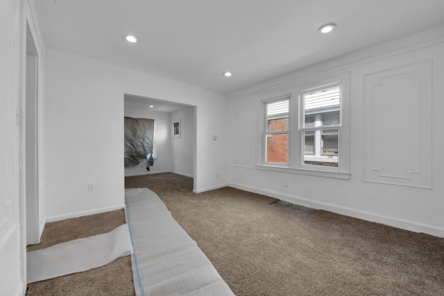 unfurnished room with carpet floors