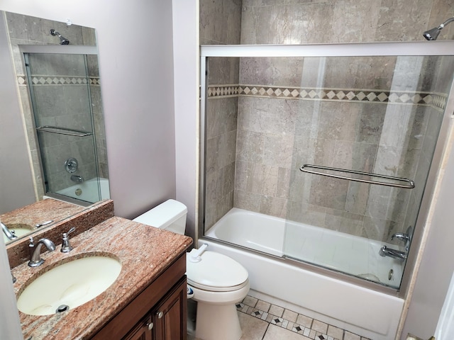 full bathroom with tile patterned flooring, vanity, toilet, and enclosed tub / shower combo