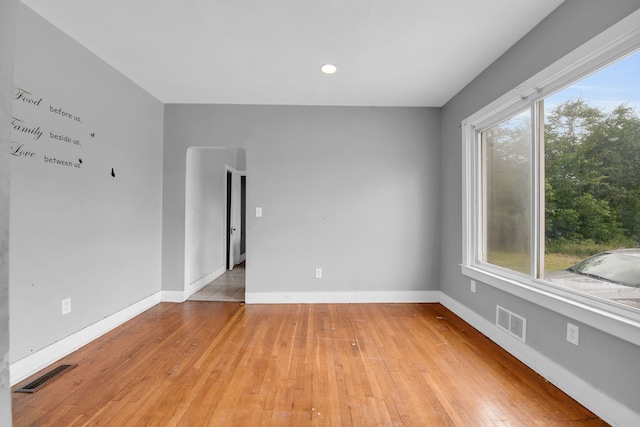 unfurnished room featuring light hardwood / wood-style floors