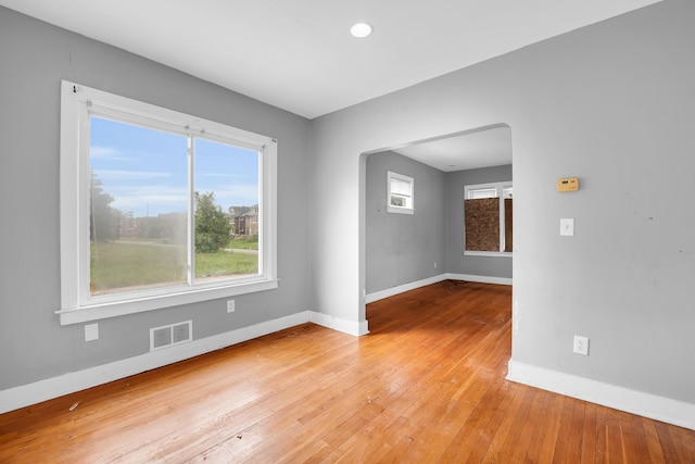 unfurnished room with light wood-type flooring