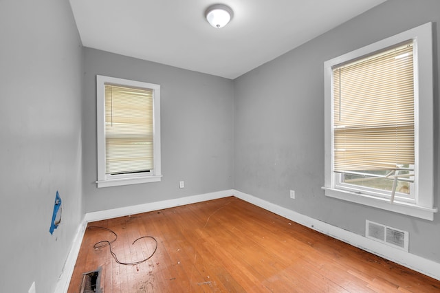 unfurnished room featuring hardwood / wood-style floors