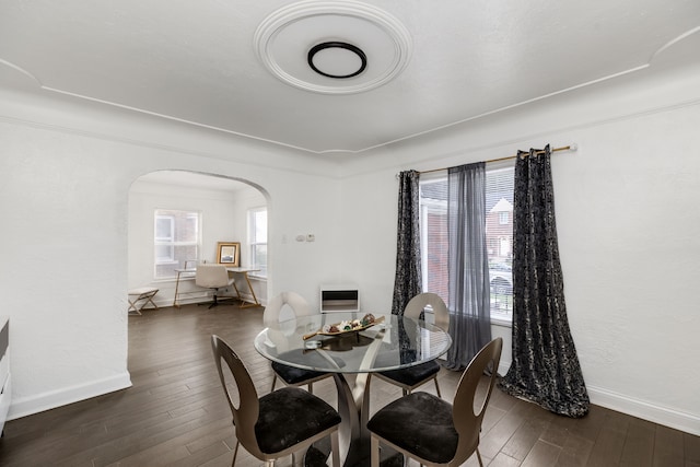 dining space featuring dark wood-type flooring