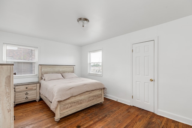 bedroom featuring dark hardwood / wood-style flooring