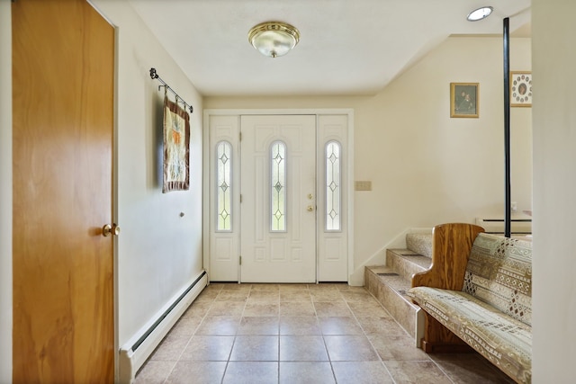 tiled foyer entrance featuring baseboard heating