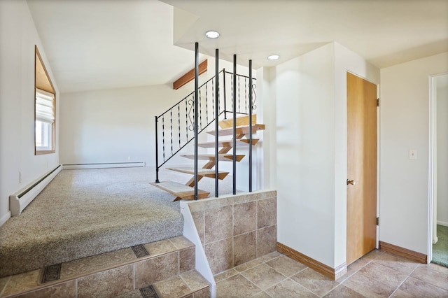 stairs featuring baseboards, lofted ceiling, baseboard heating, and carpet flooring