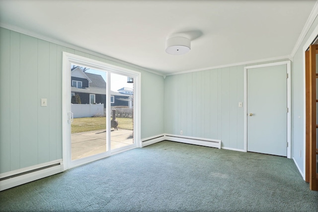 spare room with a baseboard heating unit, carpet, and ornamental molding