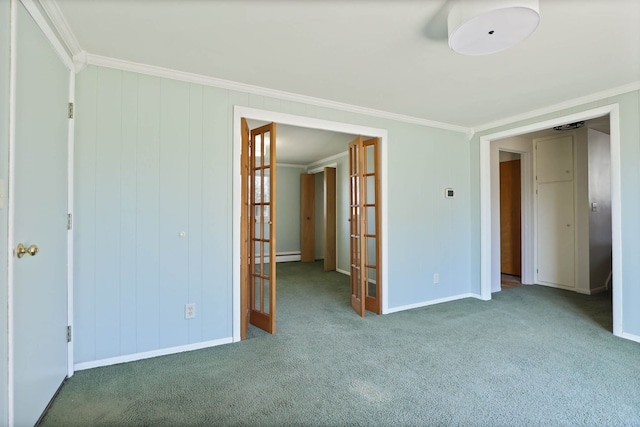 carpeted empty room featuring a baseboard heating unit, french doors, baseboards, and ornamental molding