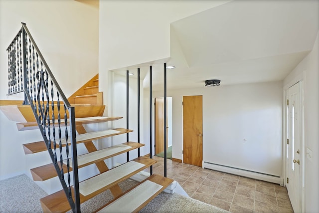 staircase featuring a baseboard radiator