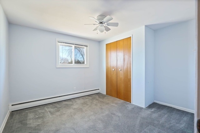 unfurnished bedroom with a closet, carpet floors, a ceiling fan, and a baseboard radiator