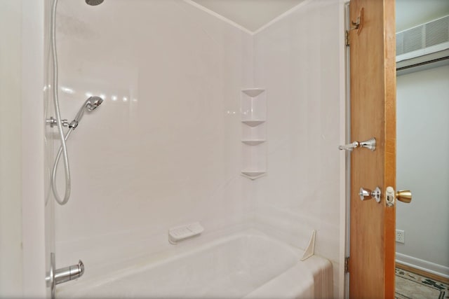 full bath featuring bathing tub / shower combination and ornamental molding