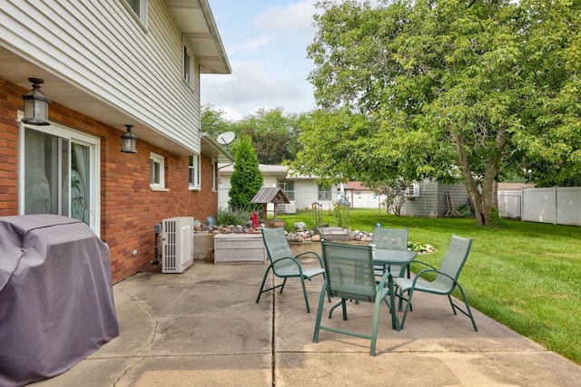 view of patio / terrace with outdoor dining space, fence, central AC, and grilling area